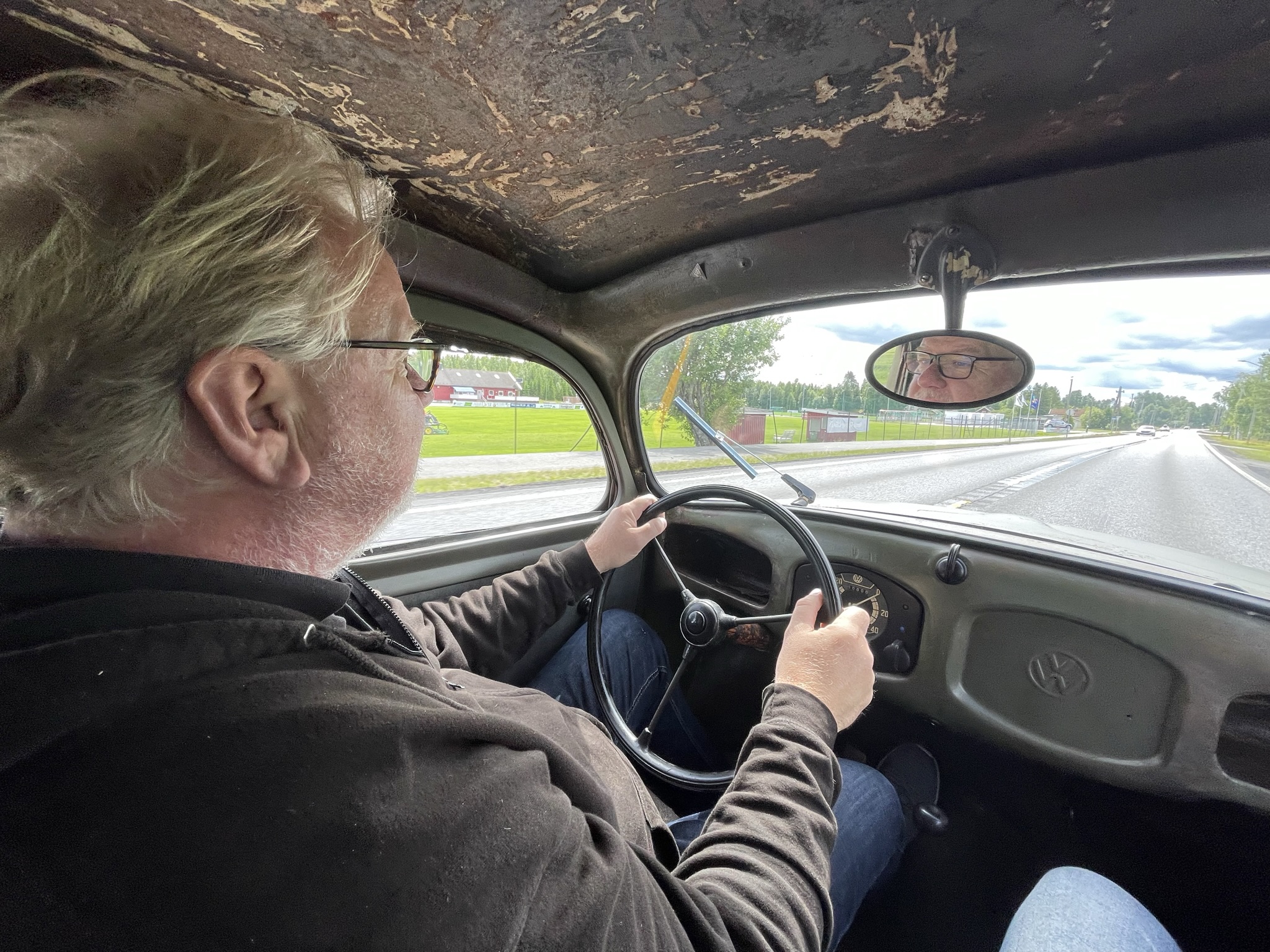 Axel Catton driving a car, 6