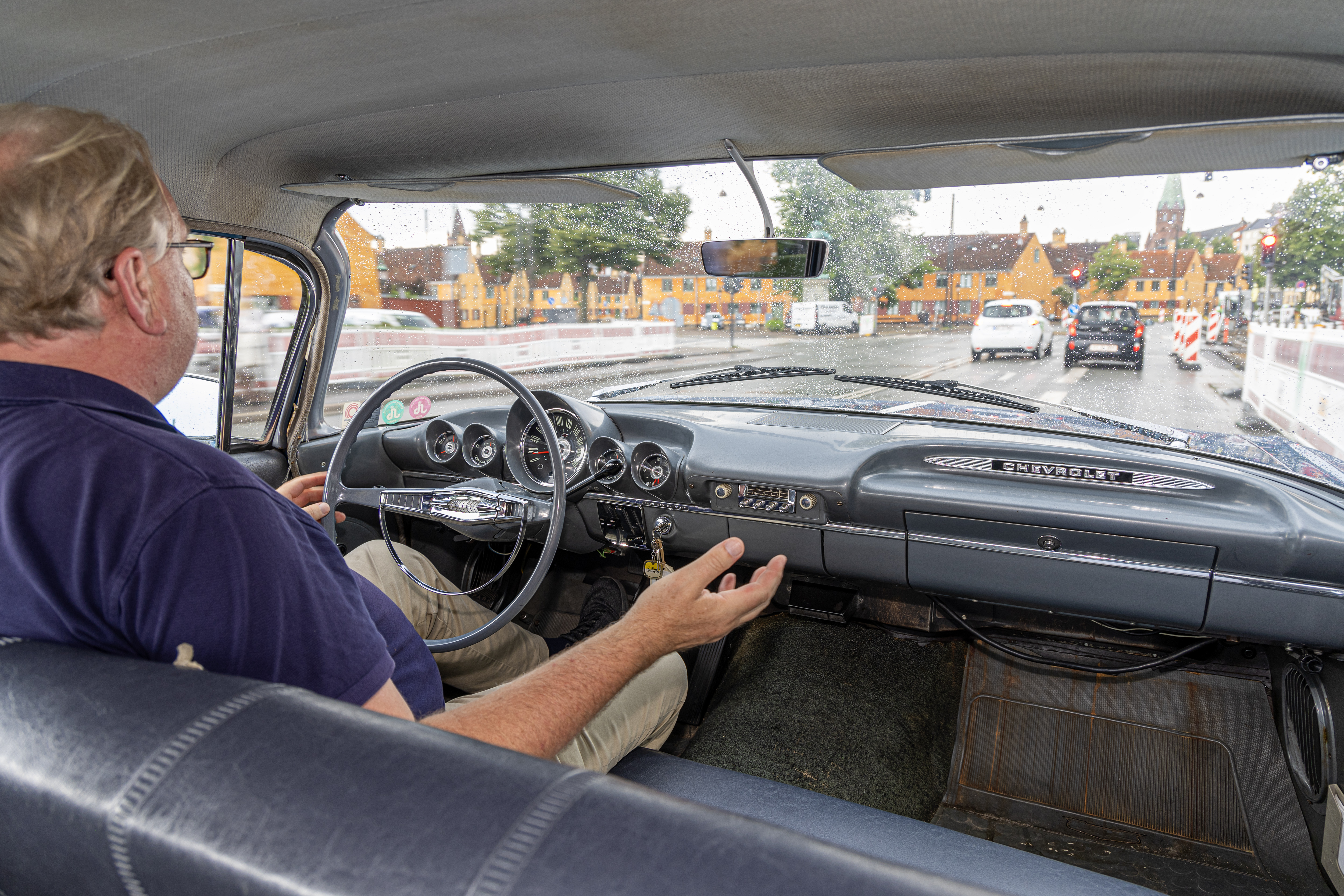 Axel Catton driving a car, 7
