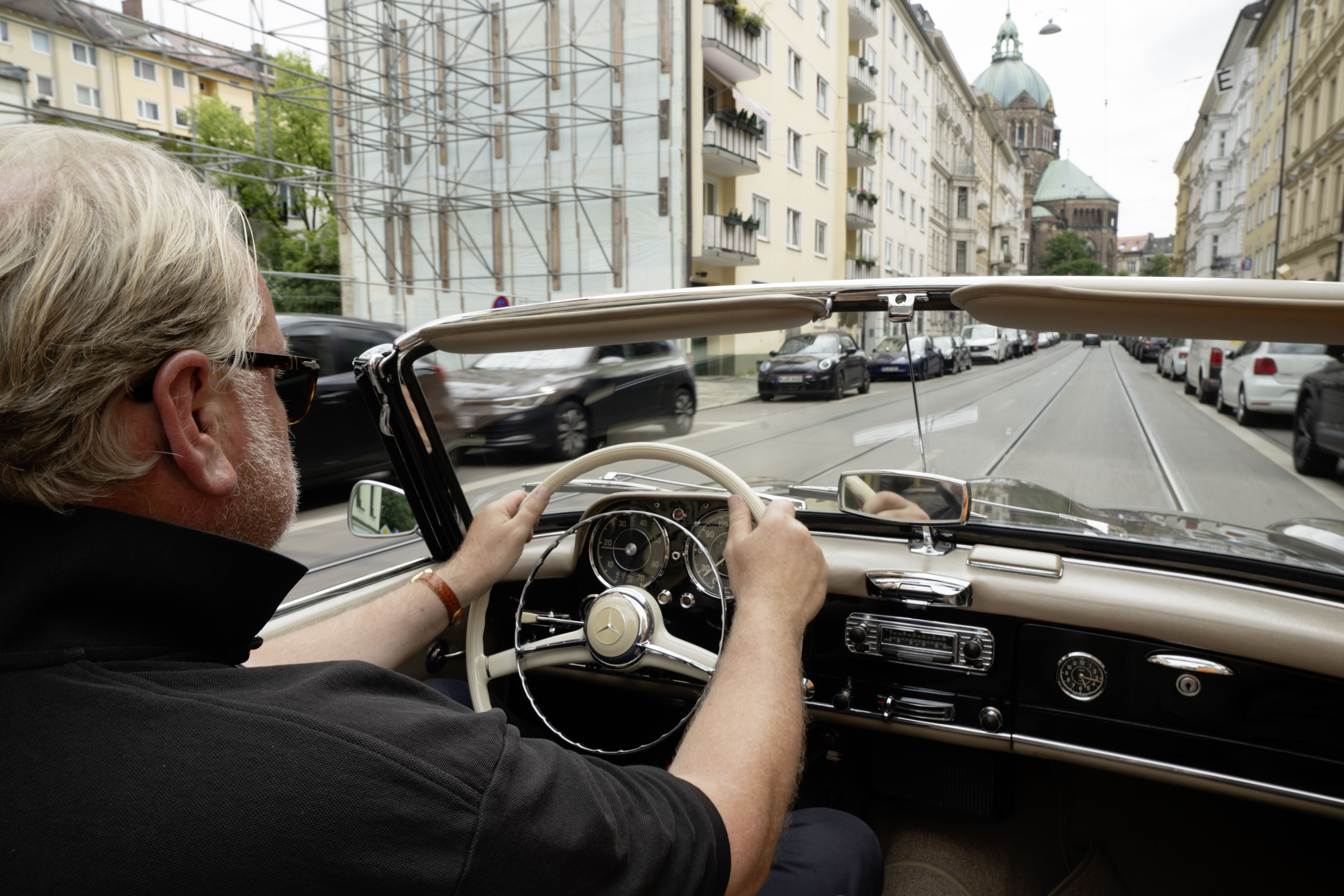 Axel Catton driving a car, 8